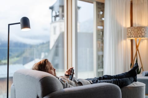 People, Living room, Seating area, Mountain view