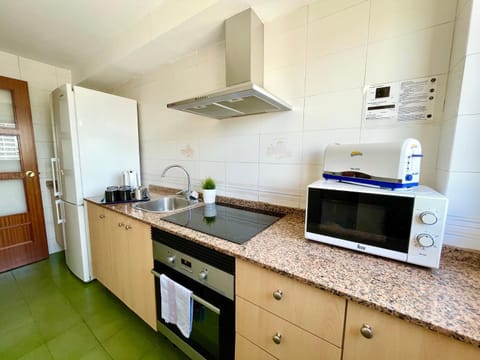 Kitchen or kitchenette, stove, kitchen