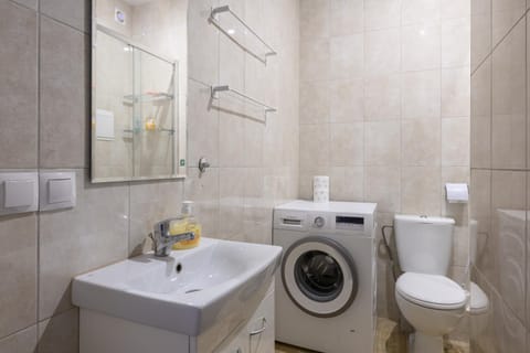 Shower, Toilet, Bathroom, towels, washing machine, dryer