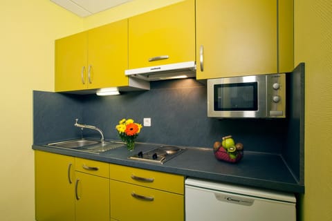 Kitchen or kitchenette, microwave, stove, kitchen