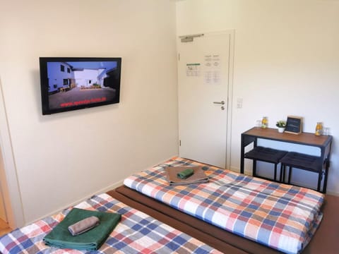 Bed, TV and multimedia, Seating area, Bedroom