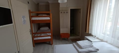 Bed, TV and multimedia, Photo of the whole room, Bedroom, City view, bunk bed, locker, towels, air conditioner