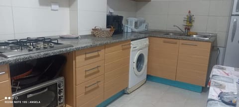 Kitchen or kitchenette, washing machine