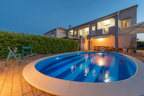 Property building, Patio, Night, Natural landscape, Pool view, Swimming pool, sunbed