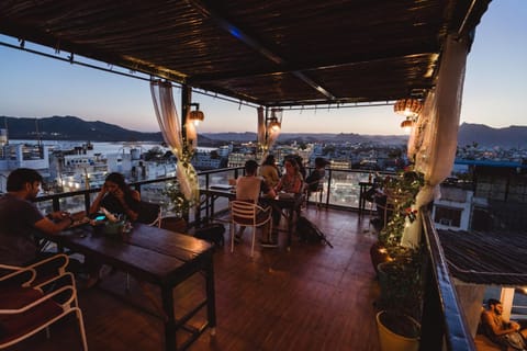 Patio, Restaurant/places to eat, Restaurant/places to eat, People, Natural landscape, View (from property/room), Balcony/Terrace, Banquet/Function facilities, Lake view, Mountain view, River view, Sea view, group of guests