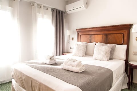Bed, Photo of the whole room, Bedroom, towels, air conditioner