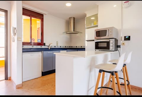 Kitchen or kitchenette, dishwasher, stove, toaster