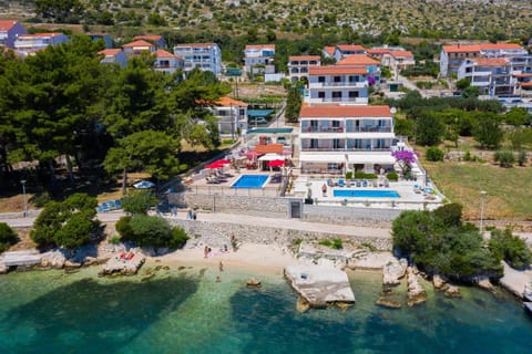 Gem of the sea luxury beach apartment with brand new heating infinity pool Condo in Split-Dalmatia County