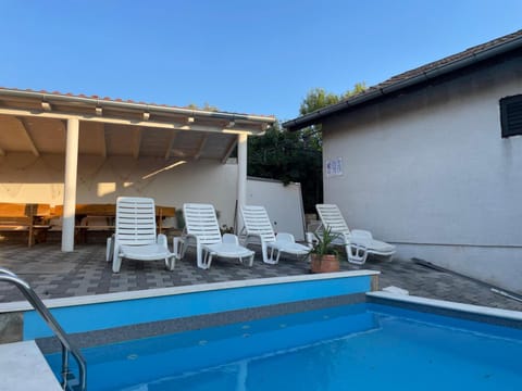 House with outdoor pool in Tisno Apartment in Tisno