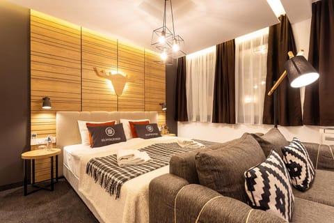 Bed, TV and multimedia, Living room, Seating area, Bedroom, wardrobe