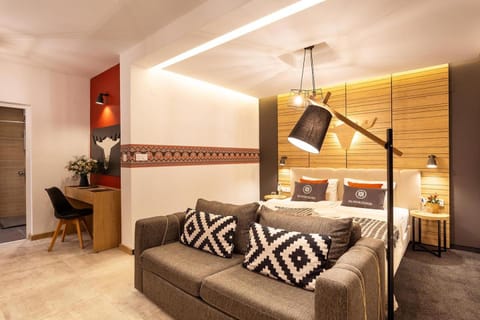 Bed, TV and multimedia, Living room, Seating area, Bedroom, wardrobe