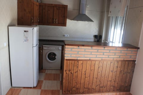 Kitchen or kitchenette, washing machine