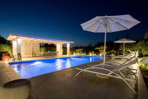 Patio, Night, Pool view, Swimming pool, sunbed