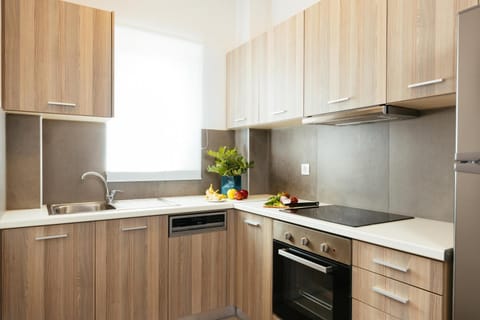 Kitchen or kitchenette, dishwasher, oven, stove
