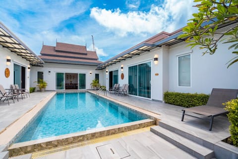 Property building, Patio, Pool view, Swimming pool, sunbed