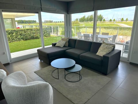 Living room, Seating area, Pool view