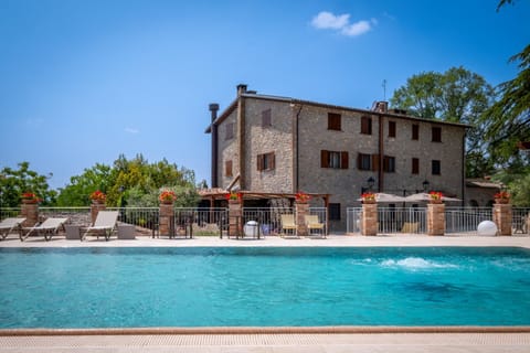 Property building, Day, Pool view, Swimming pool, sunbed