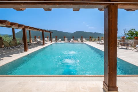 Patio, Day, Natural landscape, Pool view, Swimming pool, sunbed