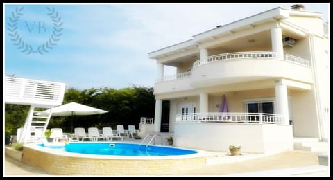 Property building, Patio, Balcony/Terrace, Pool view, Swimming pool, sunbed