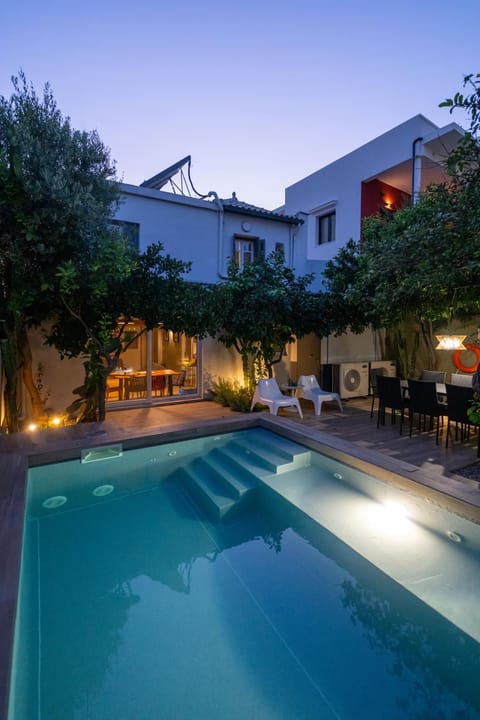 Property building, Patio, Night, Pool view, Swimming pool