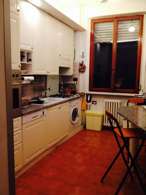 Kitchen or kitchenette, dishwasher, oven, stove, toaster, washing machine, dryer