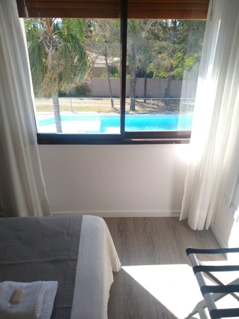 Property building, Bed, Pool view