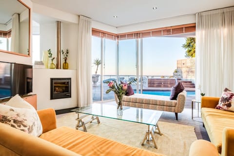 View (from property/room), Balcony/Terrace, Living room, Seating area, Pool view, Swimming pool, sunbed