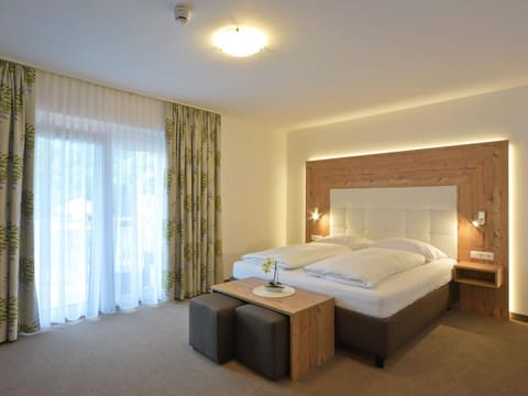 Bed, Living room, Seating area, Bedroom