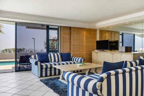 Living room, Seating area, Pool view