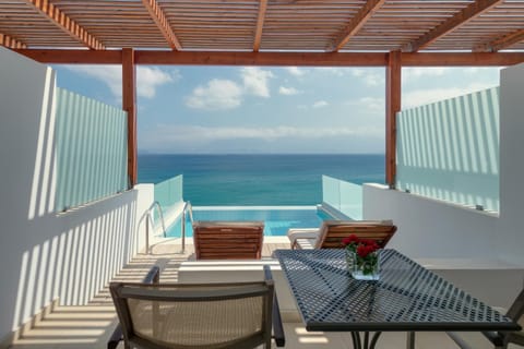 View (from property/room), Balcony/Terrace, Seating area, Sea view, Swimming pool