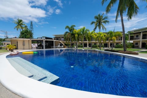 Property building, Day, Pool view, Swimming pool, sunbed