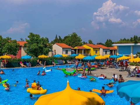 People, Natural landscape, Aqua park, Pool view, Swimming pool, group of guests, sunbed