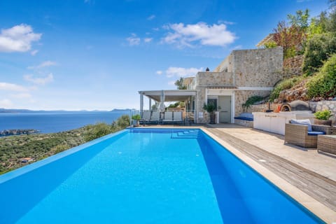 Property building, Patio, Nearby landmark, Day, Natural landscape, Pool view, Sea view, Swimming pool, sunbed