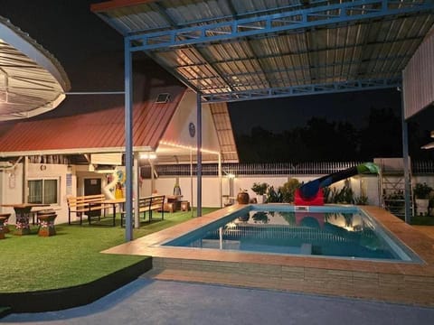 Property building, Patio, Communal lounge/ TV room, Natural landscape, Evening entertainment, Pool view, Swimming pool