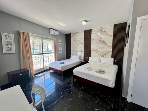 Bed, Photo of the whole room, Bedroom, City view, towels