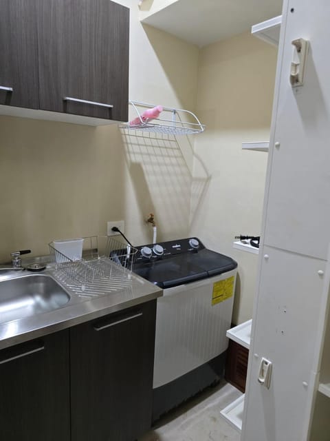 Kitchen or kitchenette, washing machine