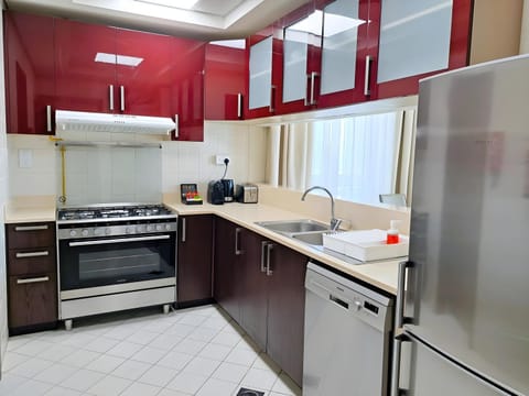 Kitchen or kitchenette, dishwasher, oven, stove, toaster
