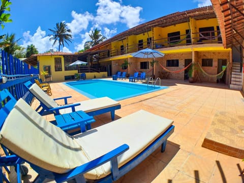 Property building, Day, Pool view, Swimming pool, sunbed