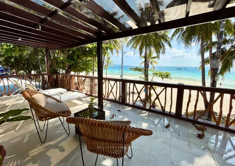 View (from property/room), Balcony/Terrace, Seating area, Beach, Sea view