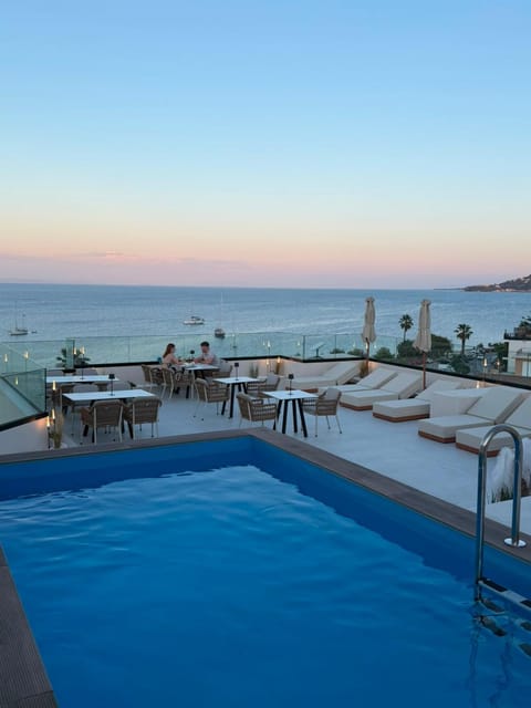 Property building, Day, Neighbourhood, Natural landscape, Summer, View (from property/room), Beach, Guests, Pool view, Sea view, Area and facilities, Swimming pool, Swimming pool, Sunset, furniture, sunbed
