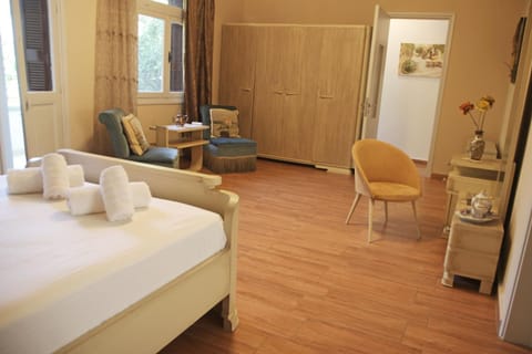 Bed, Photo of the whole room, Seating area, Bedroom, hair dresser, towels, wardrobe