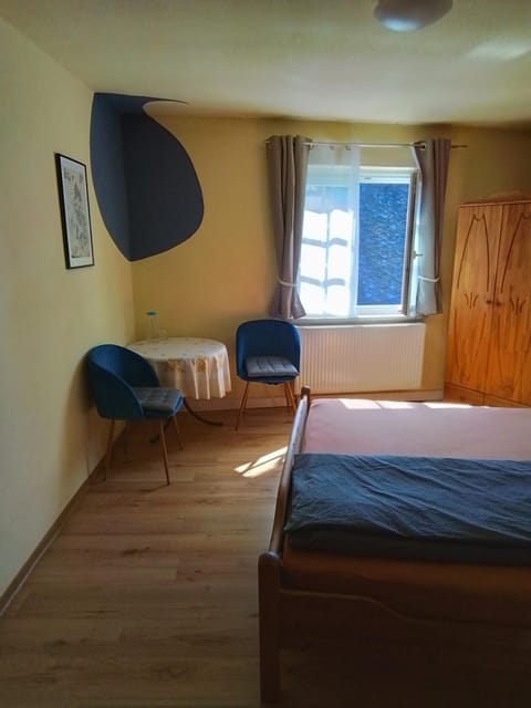 Bed, Seating area, Bedroom