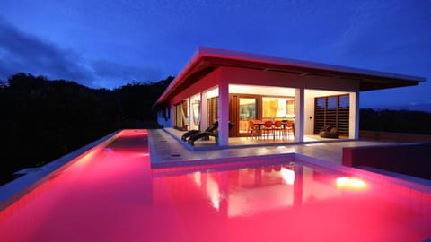 Property building, Patio, Night, Natural landscape, Balcony/Terrace, Pool view, Swimming pool