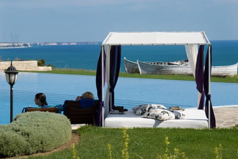 View (from property/room), Seating area, Sea view, Swimming pool