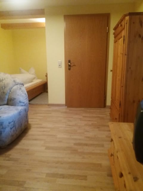 Bed, Seating area, wardrobe