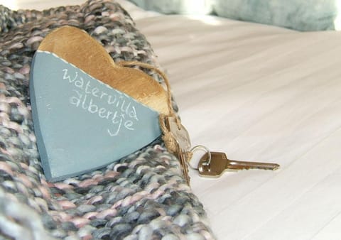 Bed, Property logo or sign, Decorative detail