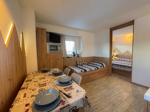 Communal lounge/ TV room, Bed, Dining area