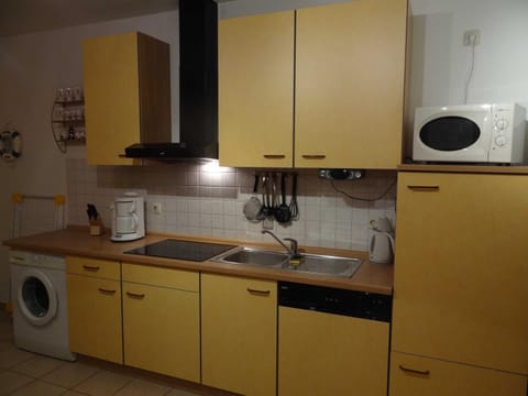 Kitchen or kitchenette, dishwasher, stove, washing machine