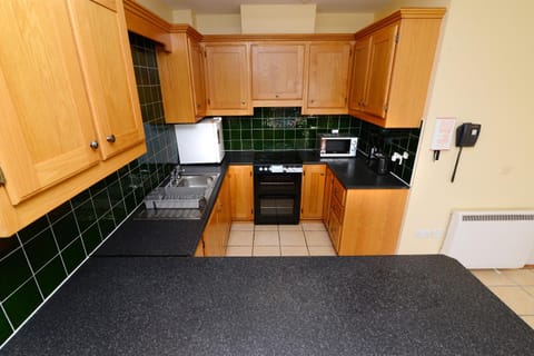Kitchen or kitchenette, oven, stove, toaster