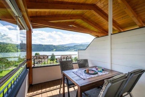 View (from property/room), Balcony/Terrace, Seating area, Lake view, Mountain view